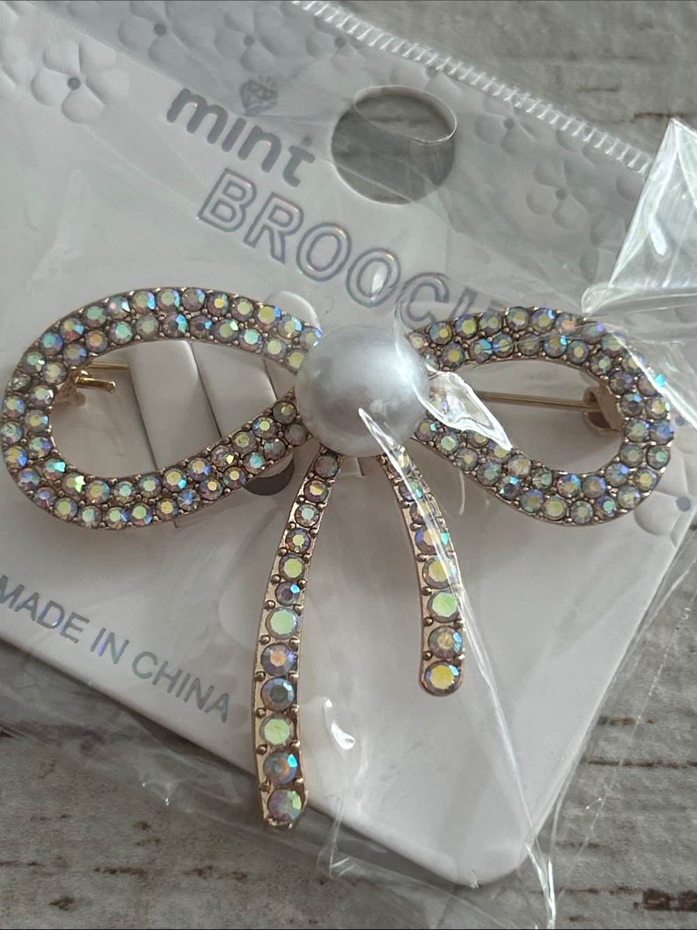 5/$25 mint Bow Brooch with Iridescent Stones and Pearl Accent